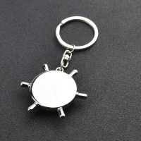 Llavero Metalico en forma de Timon con Brujula, 4.9 x 4.3 cmts