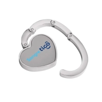 Gancho Porta Carteras plegable metalico forma de corazón, 5 cmts diametro