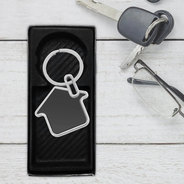 Llavero Home, metalico en forma de casa, de 3.5 x 3.4 cmts.