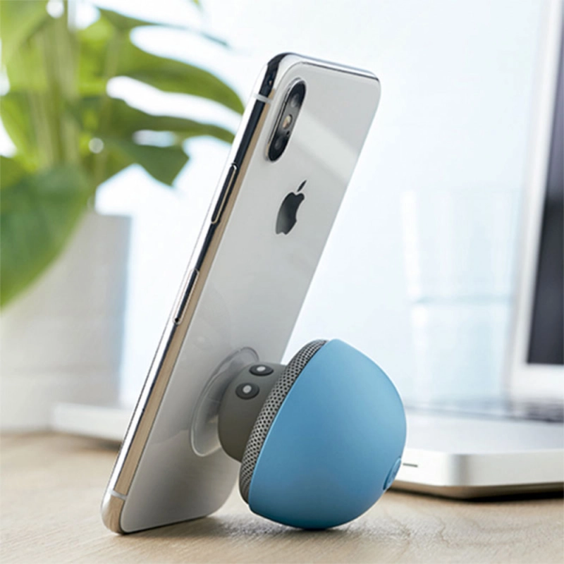 Parlante Bluetooth Bros, en silicona, con soporte para móviles, 6.8 x 5.5 cmts